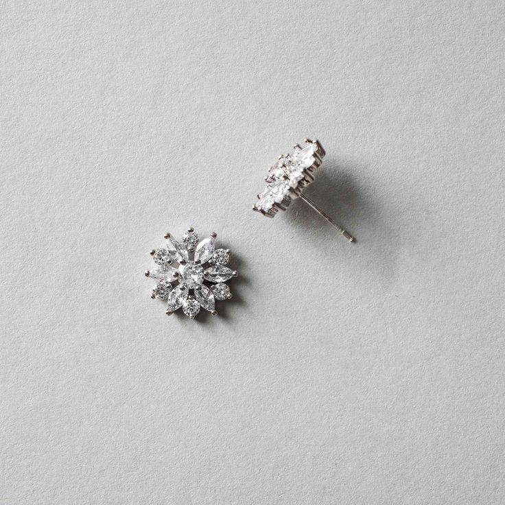 Bright CZ flower earrings for the bride or bridesmaids. Add a floral touch to your wedding day look with these beauties! They are .5 inches long and made with AAA CZ stones set in rhodium silver plating which makes them lead, nickel, and cadmium free. Flower Shaped Cubic Zirconia Jewelry For Party, Cubic Zirconia Flower Jewelry For Party, Formal Cubic Zirconia Flower Drop Earrings, Dazzling Cubic Zirconia Flower Shaped Earrings, Silver Cubic Zirconia Flower-shaped Earrings, Flower Shaped Cubic Zirconia Party Jewelry, Formal Flower Earrings With Sparkling Stones, Silver Flower Jewelry With Matching Earrings, Formal Flower Earrings With Sparkling Cubic Zirconia