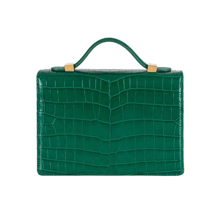 A signature Rubeus jewelled treasure that testifies to the power of classical elegance and Italian artistry. Born as the perfect Christmas present, the Flash Natale dominates all the year around. Small Natale Bag in green millenium crocodile and Luigi Bevilaqua golden and silver threads jacquard with gold-tone hardware and detachable crocodile strap. Three interior slip pockets Measurements : 20x15x5.5 cm Made in Italy Luxury Green Top Handle Shoulder Bag, Luxury Crocodile Pattern Bags For Gifts, Designer Green Bag With Crocodile Pattern, Luxury Crocodile Pattern Bags As Gift, Elegant Crocodile Pattern Bag For Gift, Elegant Crocodile Pattern Shoulder Bag As Gift, Classic Green Evening Shoulder Bag, Luxury Crocodile Pattern Shoulder Bag For Formal Events, Luxury Crocodile Pattern Shoulder Bag For Formal Occasions