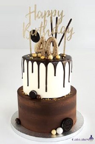 a chocolate and white birthday cake with the number forty on it's top tier