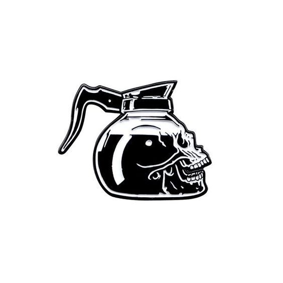 a black and white drawing of a kettle with a skull on it