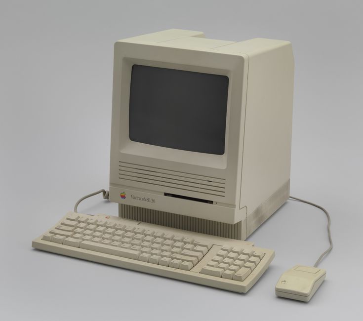 an old computer with a keyboard and mouse