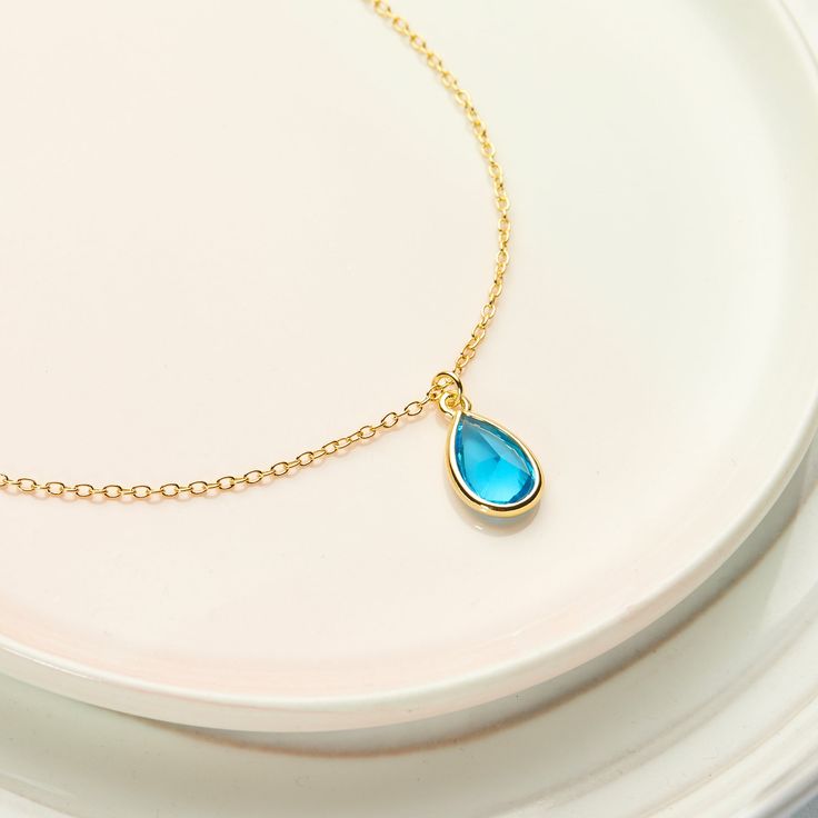 Buy Any 2 Items, Get 10% Off + Free Shipping w/ code AVA10 Beautiful blue topaz crystal birthstones are the perfect gift for December babies. Birthstones represent the best qualities in us, and are the perfect peronalized gift for birthdays, Christmas, and more. Gift your mom, daughter, sister, friend, grandma, granddaughter, aunt or niece this timeless classic for her next special occasion! J E W E L R Y ∙ D E T A I L S MATERIAL: Gold Plated CHAIN LENGTH: 18" chain + 2" chain extender PENDANT S Blue Gemstone Jewelry For Birthday Gift, Blue Birthstone Jewelry Gift For Mom, Blue Birthstone Jewelry For Mom, Blue Birthstone Necklace For Birthday Gift, Blue Sterling Silver Birthstone Necklace For Gifts, Teardrop Birthstone Necklace For Birthday, Blue Sterling Silver Birthstone Necklace As Gift, Personalized Blue Jewelry For May Birthstone, Sapphire Gemstone Birthstone Necklace For Gift