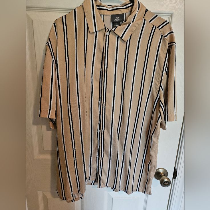 Tan With Stripes. Large Hm Button Down Short Sleeve Shirt. Large. Never Worn. Excellent Condition Casual Beige Button-up Camp Shirt, H&m Button-up Shirt For Summer, H&m Relaxed Fit Shirt With Button Closure, H&m Relaxed Fit Shirt With Buttons, Striped Collared Short Sleeve Shirt With Button Closure, Casual Striped Button-up Short Sleeve Shirt, Casual Striped Short Sleeve Button-up Shirt, H&m Relaxed Fit Collared Shirt, H&m Classic Relaxed Fit Shirt