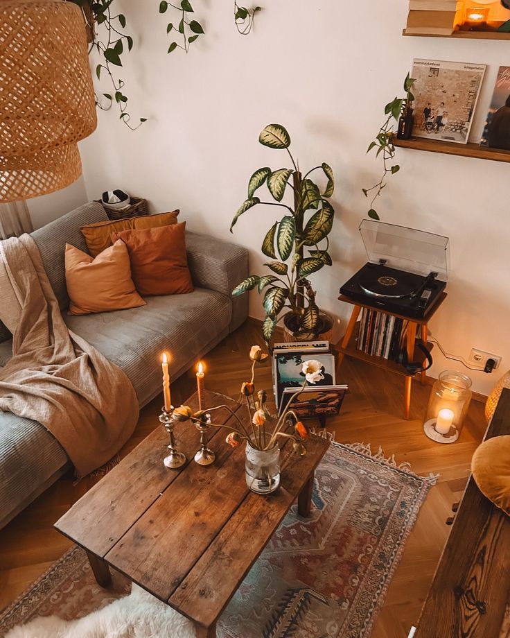 a living room filled with furniture and lots of plants