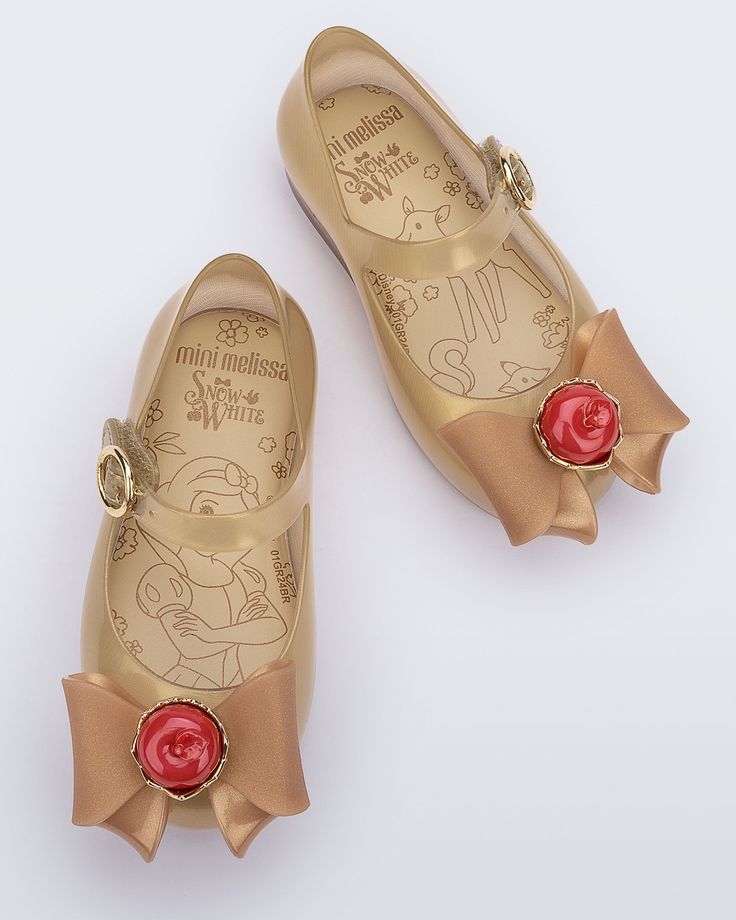 The fairest of them all, meet the Mini Melissa Sweet Love + Snow White ballerina flat. This sweet Disney collaboration brings the world of Snow White to life with a classic ballet-style shoe complete with an elaborate apple bow appliqué, a fairy tale scene on the comfy insole and varying colors to choose from. White Ballerina Flats, Melissa Sweet, The Fairest Of Them All, Baby Ballerina, Fairest Of Them All, Disney Shoes, Ballet Fashion, Mini Melissa, A Fairy Tale