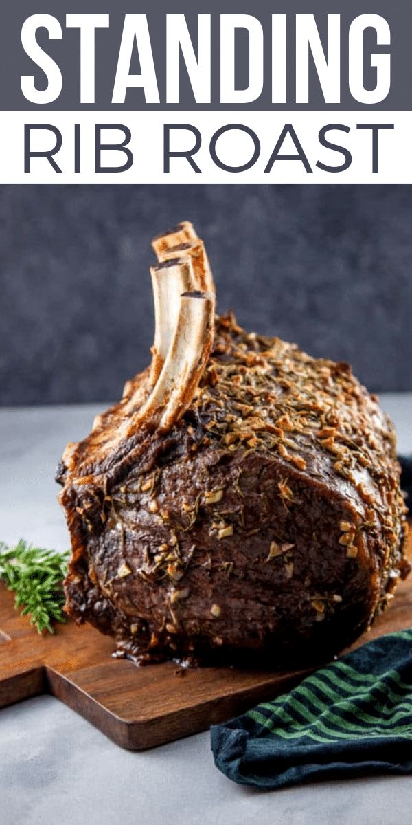 a close up of a steak on a cutting board with the title standing rib roast