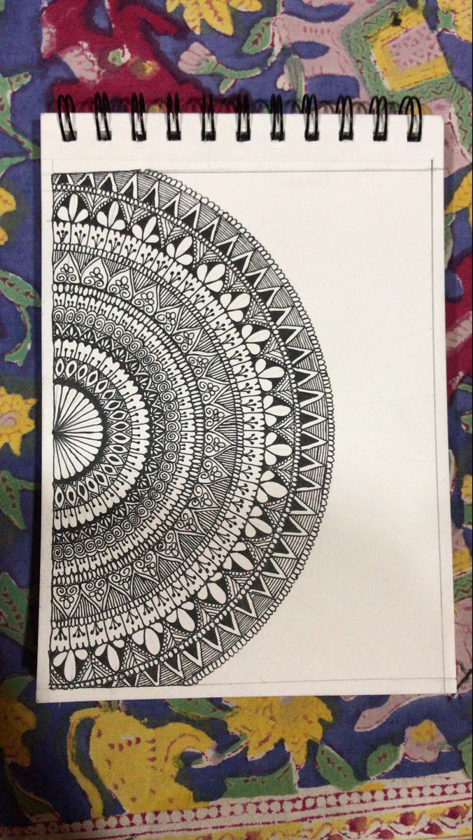 a notebook with an intricate design on it