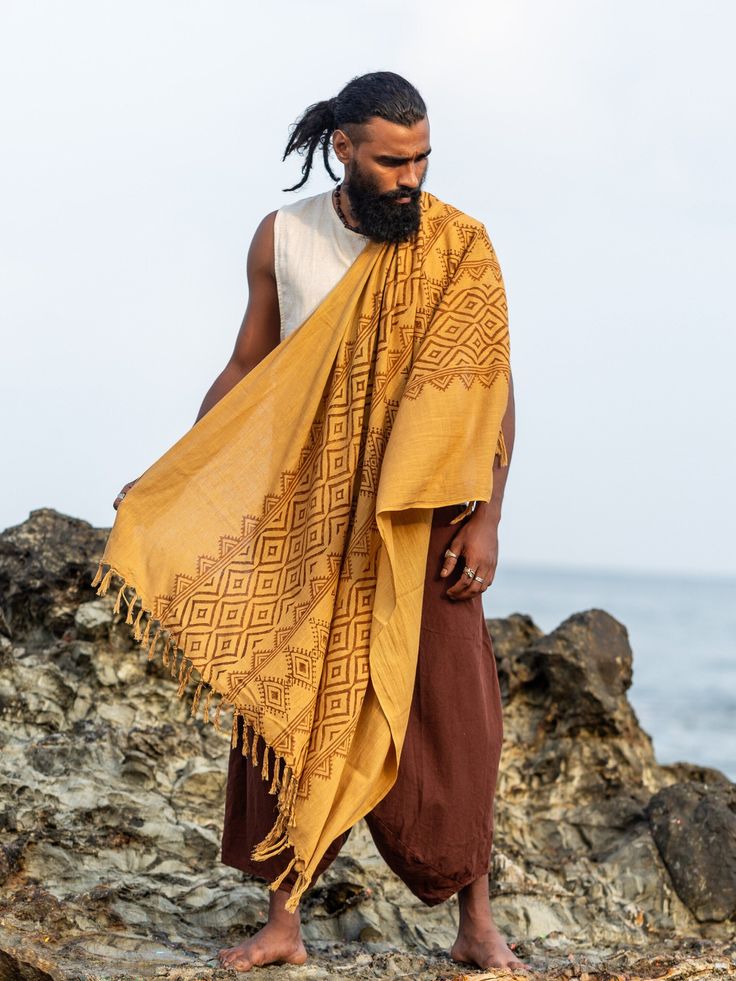 Adiyogi Shawl, perfect for summer wear. This lightweight shawl boasts a beautiful bohemian design with a touch of comfort. The unique block print makes it ten times more attractive, and the color is just perfect for any occasion. Stay stylish with the Adiyogi Shawl.  Stand out and make a statement with this unique and stylish accessory. Add a touch of flair to any outfit and let your personality shine. Express yourself with the Adiyogi Shawl and create your own fashion statement. Bohemian Sarong With Traditional Patterns For Festival, Bohemian Shawl Scarf With Natural Dye, Bohemian Shawl Scarves With Natural Dye, Bohemian Sarong With Traditional Patterns For Beach, Bohemian Dupatta With Traditional Drape, Traditional Cotton Scarf With Natural Dye, Handwoven Cotton Bohemian Shawl, Traditional Cotton Scarves With Natural Dye, Folk Style Cotton Dupatta For Festival