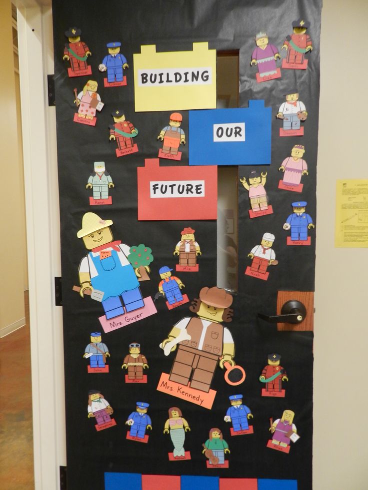 a door decorated with legos and construction related paper cutouts that read building our future