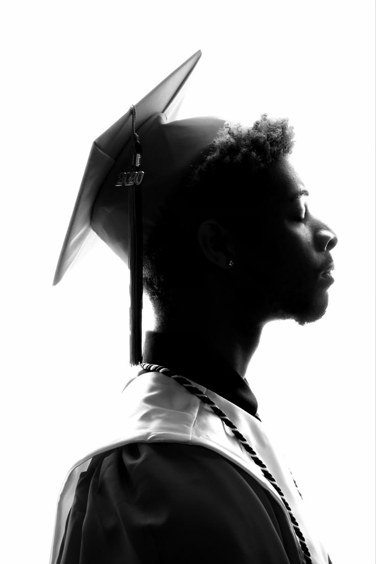 a man wearing a graduation cap and gown