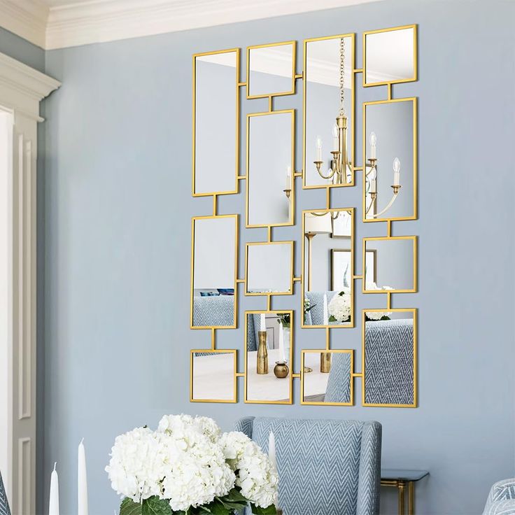 a dining room with blue walls and white flowers