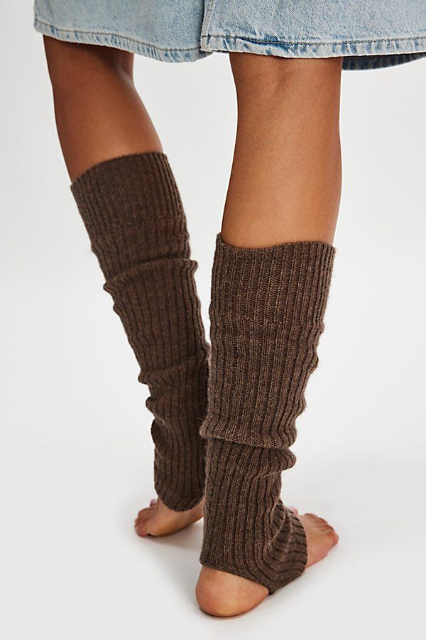 Sure to be the coolest addition to your accessories collection, these totally timeless legwarmers are featured in a sleek, ribbed knit fabrication and toe-less, heel-less style for the perfect wear-anywhere style. | Ribbed Stirrup Legwarmers by Hansel From Basel at Free People in Brown Trendy Ribbed Winter Bottoms, Ribbed Fitted Bottoms For Winter, Brown Leg Warmers For Fall, Solid Footless Leg Warmers For Fall, Cozy Brown Leg Warmers For Fall, Brown One-size Leg Warmers For Fall, Fitted Ribbed Leg Warmers For Spring, Trendy Fitted Solid Leg Warmers, Comfortable Leg Warmers For Spring