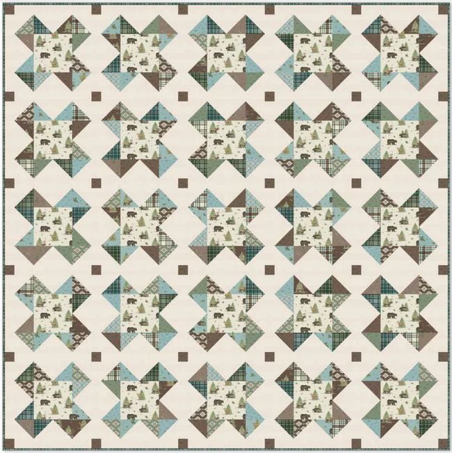 a quilt made with blue and brown squares on white fabric, the pattern is very similar to