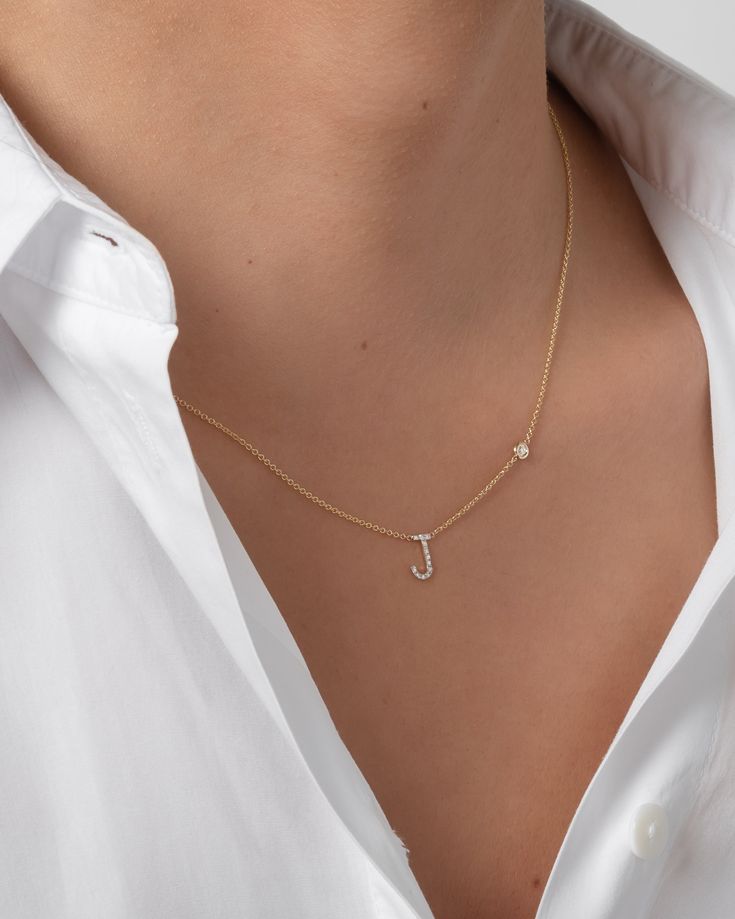 Beautifully handcrafted 14k gold pave diamond initial and a small bezel diamond on a dainty cable link chain necklace. Available in white, yellow and rose gold. This stunning piece will be you new favorite necklace! Wear it with your initial, or your loved one's. Made in L.A. Size of Initial: Approx. 8mm Diamond Bezel Carat Weight: Approx. 0.03 (ct. tw) Diamond Clarity: VS Diamond Initial Carat Weight: Approx. 0.11 (ct. tw) Ships in 4-9 business days Rush orders ship in 2-5 business days All per Bezel Necklace Diamond, Evil Eye Necklace Gold, Diamond Initial Necklace, Pretty Jewelry Necklaces, Double Chain Necklace, Bezel Necklace, Initial Necklace Gold, Vs Diamond, Link Chain Necklace