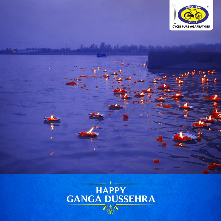 there are candles floating in the water on this lake that says happy gangga dusseria