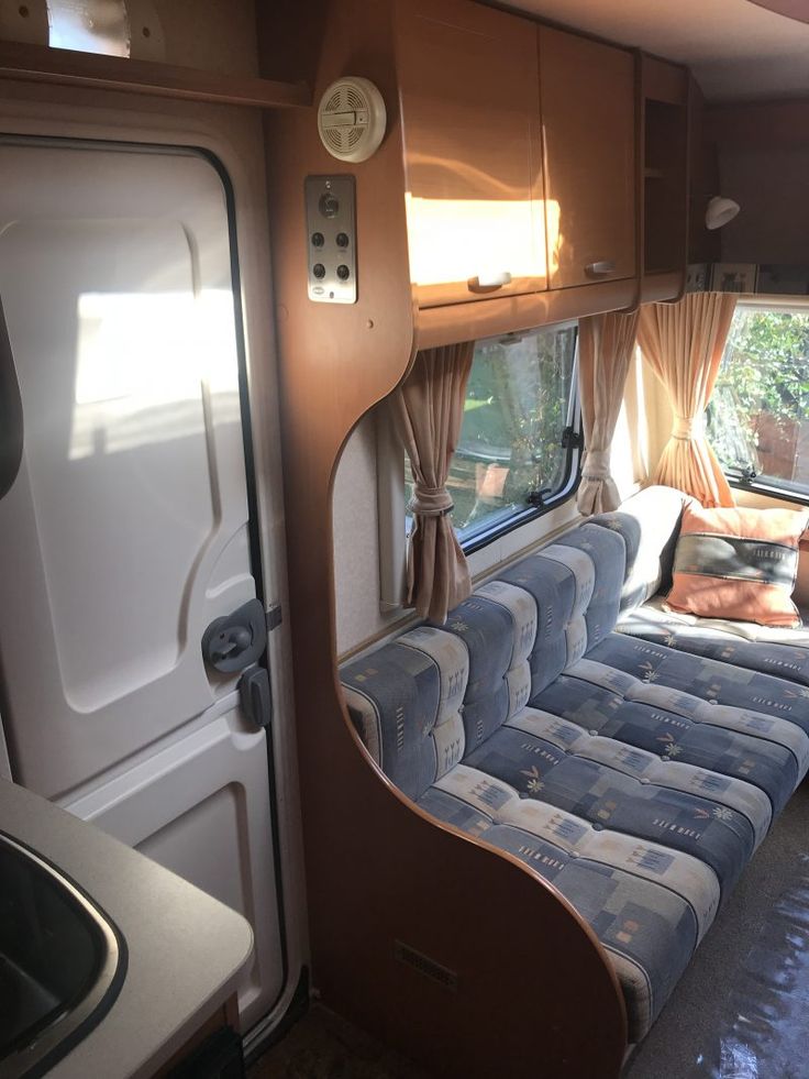 the interior of an rv is clean and ready to be used as a camper