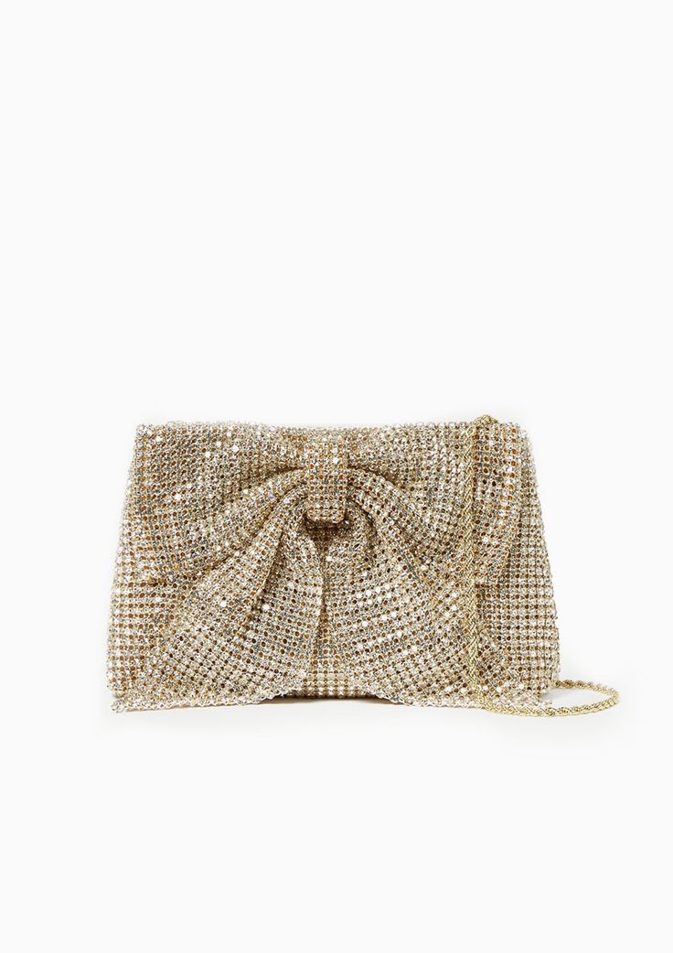 Pleated frame clutch in gold diamanté from Loeffler Randall with a statement-making bow. Features a removable twisted gold chain shoulder strap, covered magnet closure, full lining, and logo plaque. 100% Cotton Fabic with Glass Rhinestones Dimensions: 8.5" x 1.5" x 6" 12" Strap Drop Gold Crystal Embellished Evening Bag For Gala, Glamorous Clutch With Chain For Formal Occasions, Glamorous Gold Clutch For Gala, Glamorous Gold Evening Bag With Chain, Gold Evening Bag With Gold-tone Hardware For Gala, Elegant Gold Evening Bag With Chain, Elegant Clutch With Gold-tone Hardware, Glamorous Evening Bag With Gold-tone Hardware, Glamorous Clutch With Chain Detail