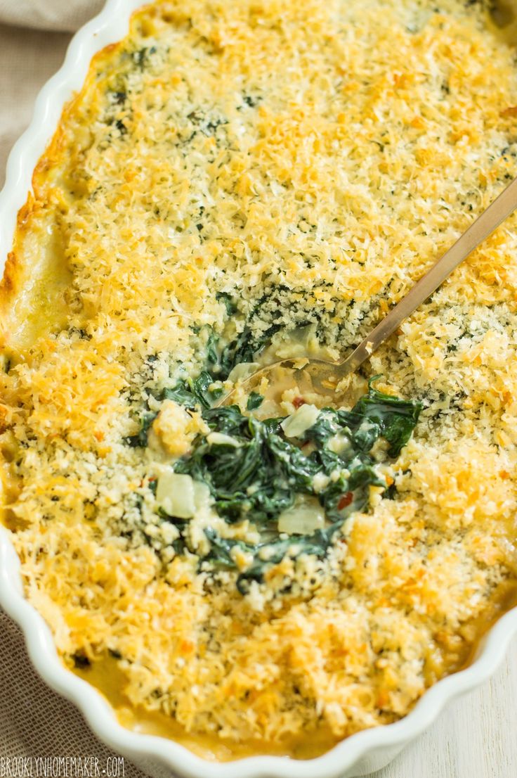 a casserole dish filled with spinach and cheese