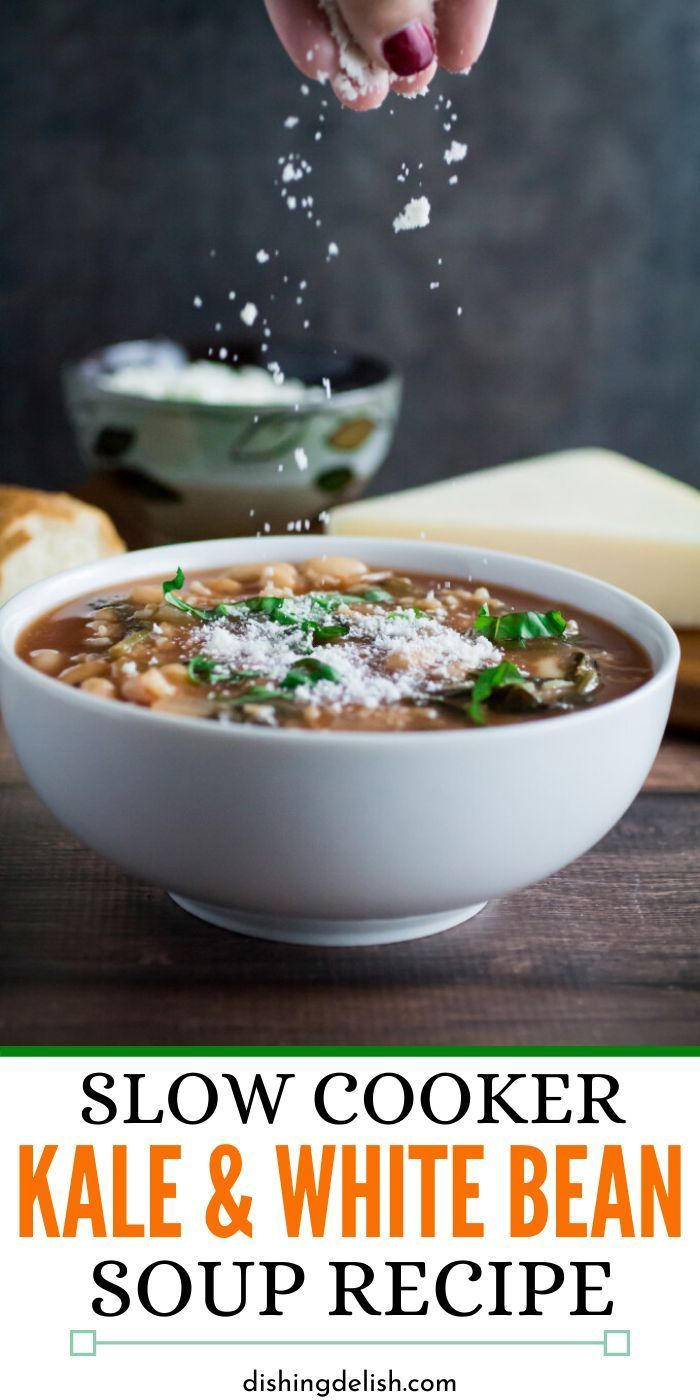 slow cooker kale and white bean soup recipe in a bowl with parmesan cheese sprinkled on top