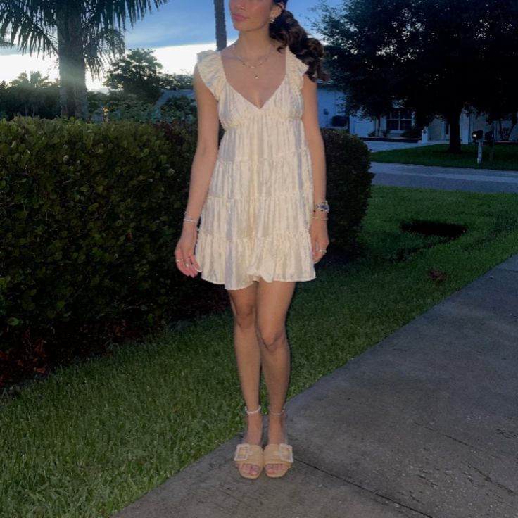 Look Like A Sweetheart Babe In This Lightweight, Flowy Dress Featuring A V-Neckline And Fluttery Short Sleeves That Can Be Worn On Or Off-The-Shoulder. Darling Pleats Accent And Shape The Bodice, With An Empire Waist And Flowy Mini Skirt. Cute V-neck Sundress For Vacation, V-neck Ruffled Sundress Mini Dress, Cute Mini Dress With Flutter Sleeves And Ruffles, Cute V-neck Sundress For The Beach, Cute V-neck Sundress For Beach, Flirty V-neck Sundress With Ruffles, Cute V-neck Dress With Ruffle Hem, Cute V-neck Beach Sundress, Sundress With Ruffles And Sweetheart Neckline