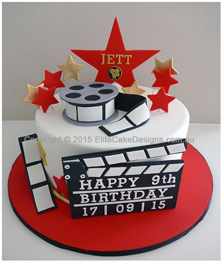 a birthday cake for a film director with stars and claps on top, sitting on a red plate