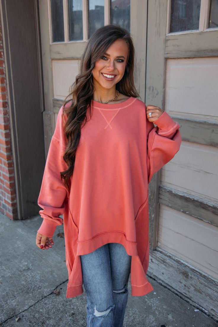 This Happy Pullover is an oversized, long-sleeve style in a vibrant rust hue! Put it on and leave; it is so easy to pair! A lower hem in the back plus the oversized design make it cute and comfortable! Liz is 5'3" and wearing a size small. Shell: 85% Cotton, 15% Polyester Contrast: 95% Cotton, 5% Spandex Oversized Fit, we recommend sizing down Rust Long Sleeve Tops For Fall, Oversized Orange Long Sleeve Top, Asymmetrical Sweatshirt, Fawn Design, Vintage Havana, Denim Shoes, Long Blonde Hair, Denim Branding, Oversized Top