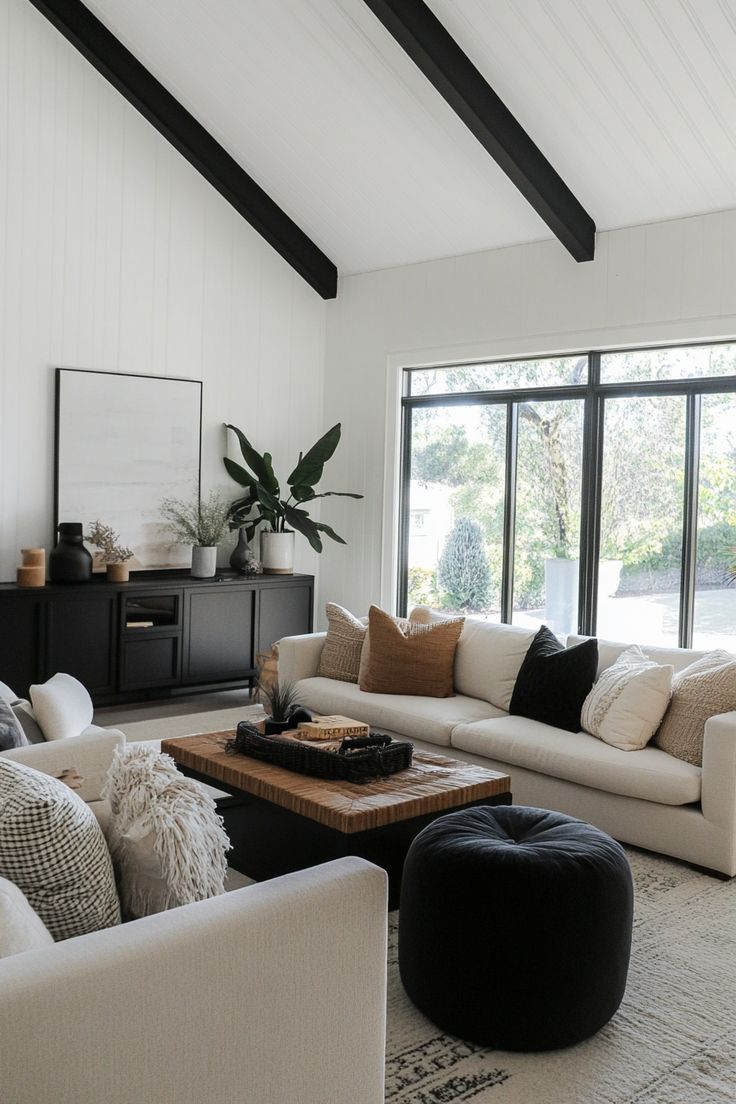 Black And Tan House Decor, Living Room With Black Window Frames, Gray Black Beige Color Palette, Wood Black White Living Room, Black Modern Boho Living Room, Modern Cozy Living Room Apartment, Modern Day Living Room Ideas, White And Black With Wood Accents, Black White Oak Living Room