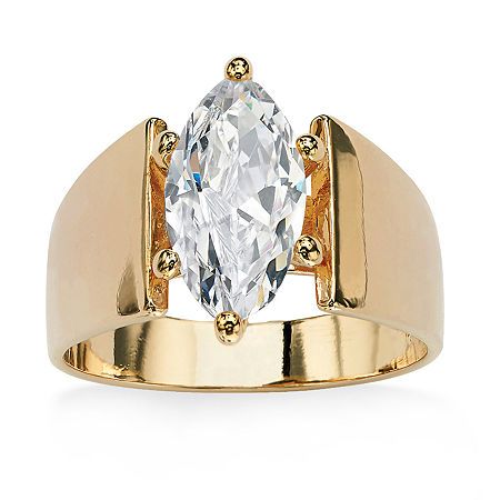 a gold ring with an oval cut diamond