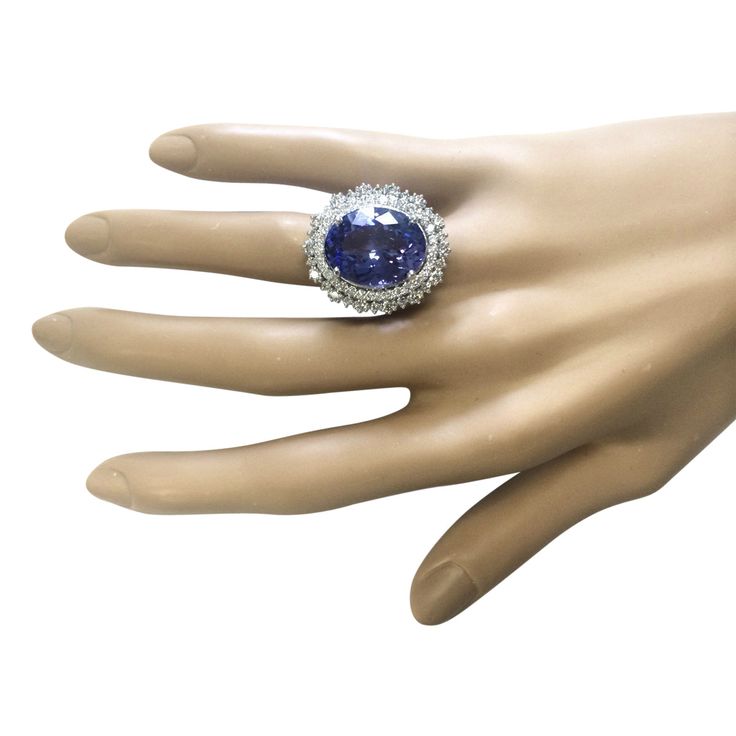 Stamped: 14K White GoldTotal Ring Weight: 9.7 GramsRing Length: N/ARing Width: N/AGemstone Weight: Total Natural Tanzanite Weight is 11.75 Carat (Measures: 16.92x12.92 mm)Color: BlueDiamond Weight: Total Natural Diamond Weight is 2.00 CaratColor: F-G, Clarity: VS2-SI1Face Measures: 26.08x22.48 mmSku: [703547W] Formal Round Cubic Zirconia Gemstones, Round Cubic Zirconia Gemstones For Formal Occasions, Formal Multi-stone Gemstones, Luxury Tanzanite Diamond Ring For Formal Occasions, Luxury Tanzanite Ring With Center Stone, Luxury Round Tanzanite Gemstones, Formal Round Cut Tanzanite Gemstones, Luxury Tanzanite Gemstones, Oval Brilliant Cut Party Ring