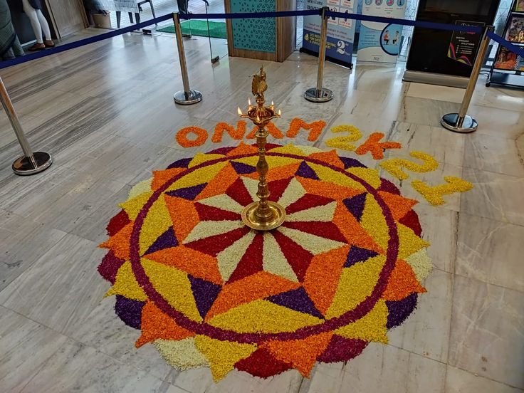 a colorful carpet with the word omsk written on it in front of an entrance