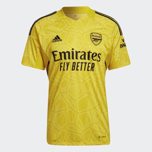 a yellow soccer jersey with the words emirates's fly better on it and black lettering