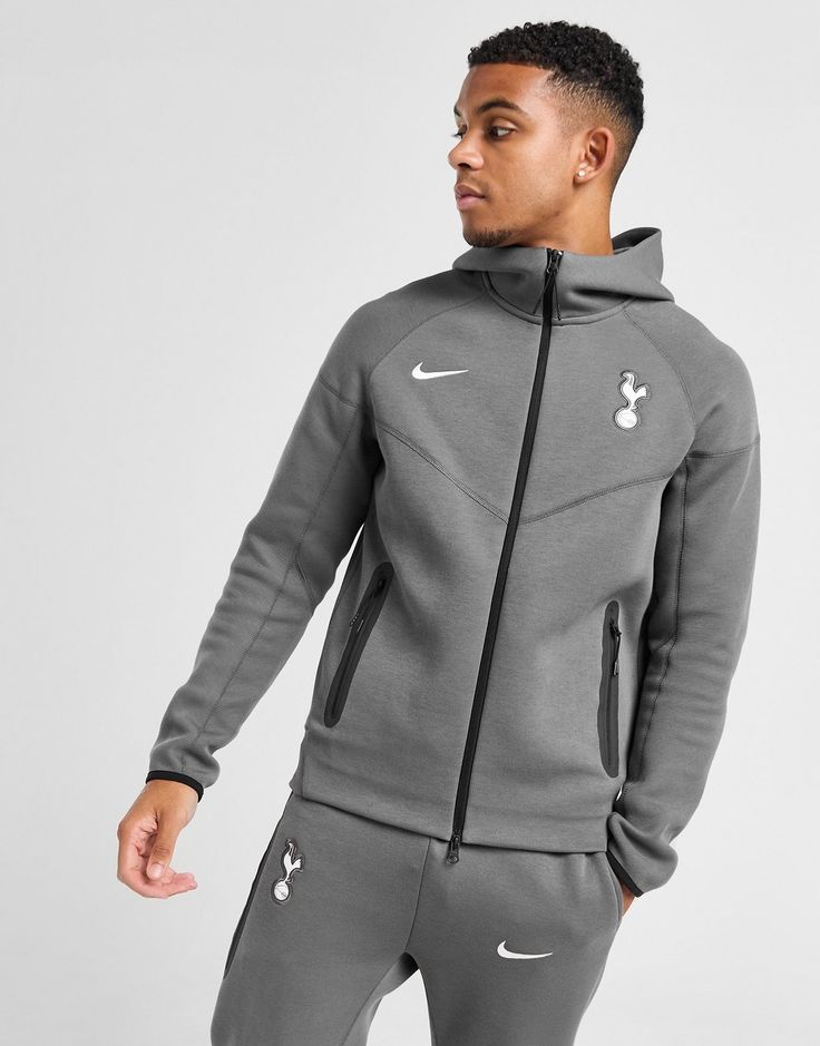 Layer up on matchday in this men's Tottenham Hotspur FC Tech Fleece Full Zip Hoodie from Nike. In a Dark Grey colourway, this standard fit hoodie is cut from Nike's iconic Tech Fleece for total comfort. It features a hood and full-zip fastening for coverage, with elasticated cuffs to hold the shape and side pockets for stashing your stadium essentials. Signed off with the Spurs crest and Nike Swoosh to the chest. Machine washable. Nike React Vision, 270 Nike, Tottenham Hotspur Fc, Chest Machine, Football Training, Sports Fashion, Tech Fleece, Grey Nikes, Nike Swoosh