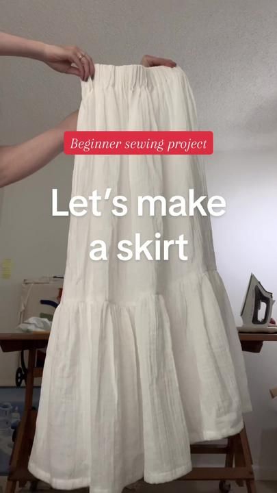 a woman is holding up a skirt with the words, let's make a skirt