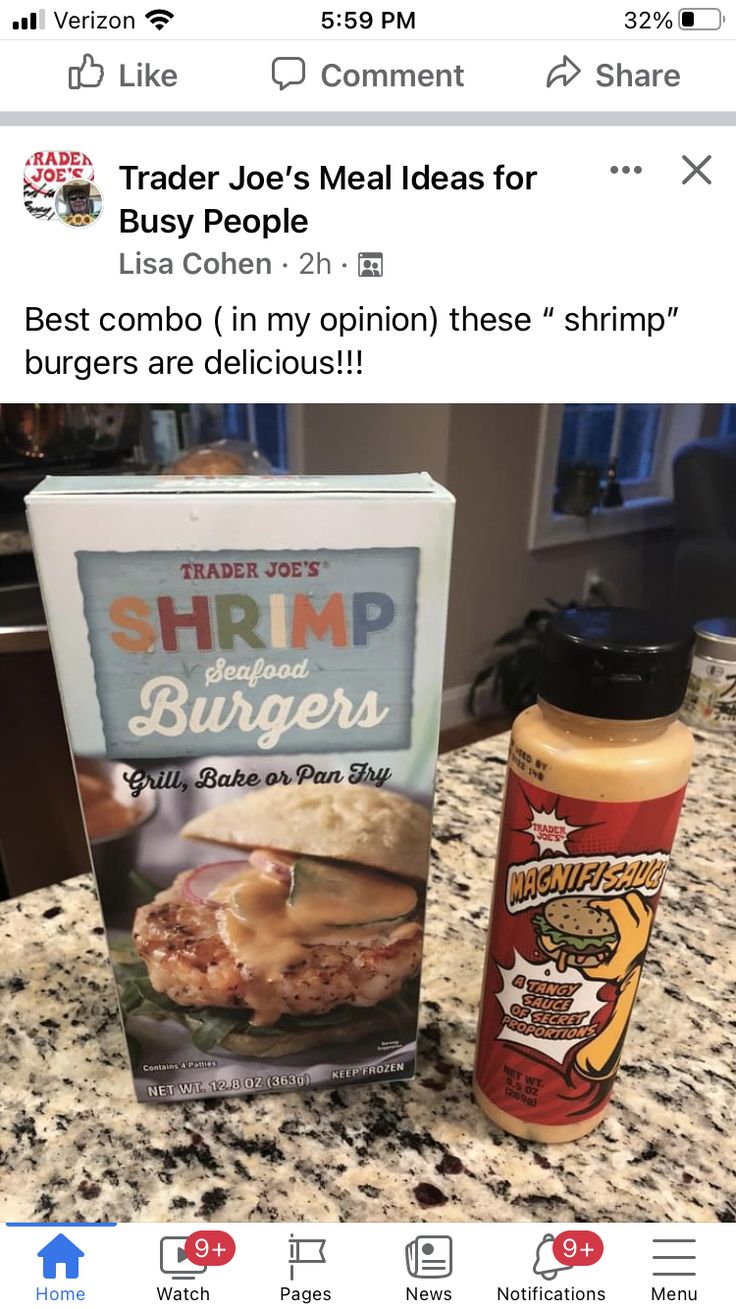 a box of shrimp burgers next to a bottle of ketchup on a counter