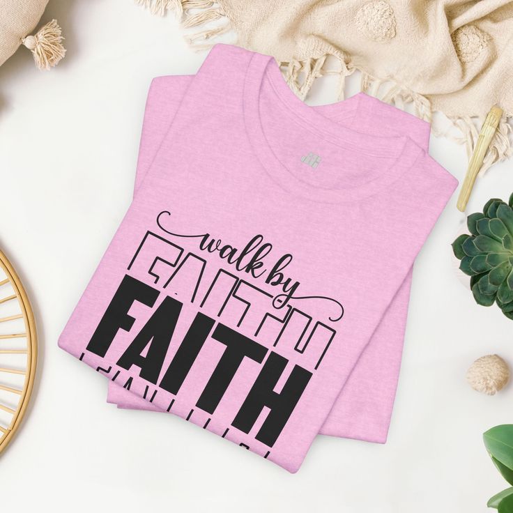 Walk by Faith Shirt Introducing our "Walk by Faith" Bible Verse Christian Shirt, a powerful expression of faith and resilience. Inspired by the timeless words of scripture, this shirt serves as a reminder of the strength and courage found in trusting in a higher power. Crafted with care and attention to detail, our shirt boasts a comfortable and flattering fit, making it a versatile addition to your wardrobe. Whether worn alone or layered under your favorite jacket, it's perfect for everyday wea Inspirational Slogan Shirt, Mother Baby Nurse, Bible Verses About Faith, Emergency Nursing, Faith Christian, Nursing Mother, Faith Bible, Faith Shirt, Christian Shirt