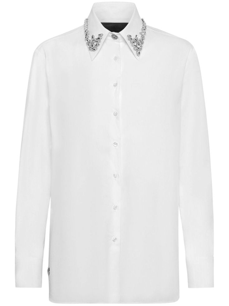 white cotton poplin texture crystal embellishment silver-tone stud detailing pointed flat collar front button fastening long sleeves buttoned cuffs curved hem Elegant Workwear Shirt With Embellished Collar, Elegant Button-up Embellished Blouse, Elegant Embellished Button-up Blouse, Embellished Button-up Workwear Blouse, Elegant Workwear Tops With Embellished Collar, Elegant Tops With Embellished Collar For Work, Elegant Blouse With Embellished Collar For Work, Elegant Formal Shirt With Embellished Collar, Luxury Long Sleeve Embellished Blouse