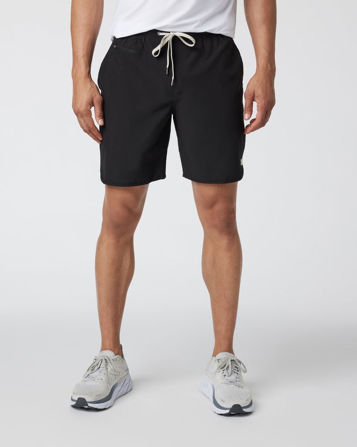 The ultimate in versatility, the Banks Shorts are made from partially recycled plastic bottles to take you from workouts to the water and beyond. It’s an athletic short built with a scalloped leg for your most universal performance item. | Vuori Banks Shorts | Black | XXL Vuori makes premium performance apparel inspired by the active Coastal California lifestyle; an integration of fitness, surf, sport, and art. Breaking down the boundaries of traditional activewear, we are a new perspective on p Lightweight Athleisure Activewear For Beach, Lightweight Black Activewear For Summer, Sporty Swim Trunks With Functional Drawstring For Workout, Functional Swim Trunks With Relaxed Fit For Workout, Functional Relaxed Fit Swim Trunks For Workout, Summer Workout Athletic Shorts In Recycled Polyester, Functional Short Length Activewear For The Beach, Functional Short Length Beach Activewear, Functional Black Athletic Shorts For Beach