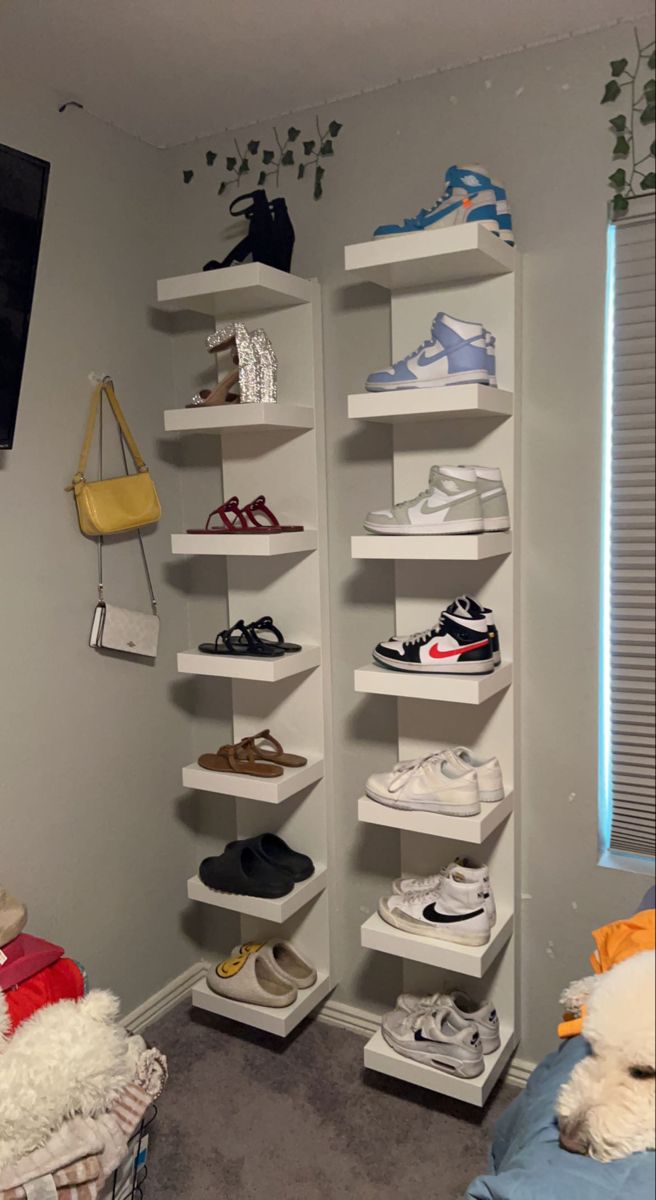 a room with several shelves filled with shoes