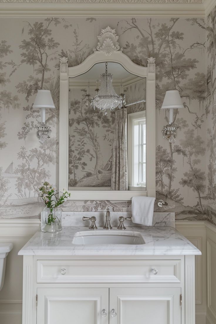 a bathroom with a sink, mirror and wallpaper