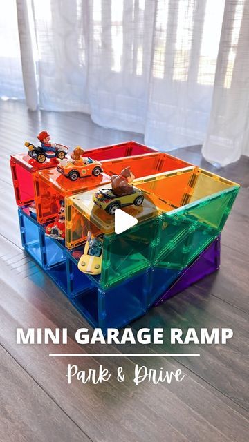 an image of a toy car garage ramp made out of legos and plastic blocks