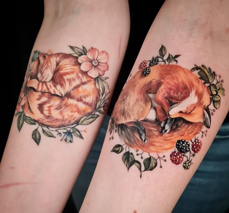 two tattoos on the legs of people with foxes and berries around them, one is red