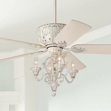 a white ceiling fan with crystal chandelier hanging from it