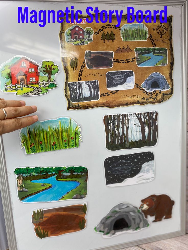 a person holding up a magnet board with different pictures on it and the words magnetic story road