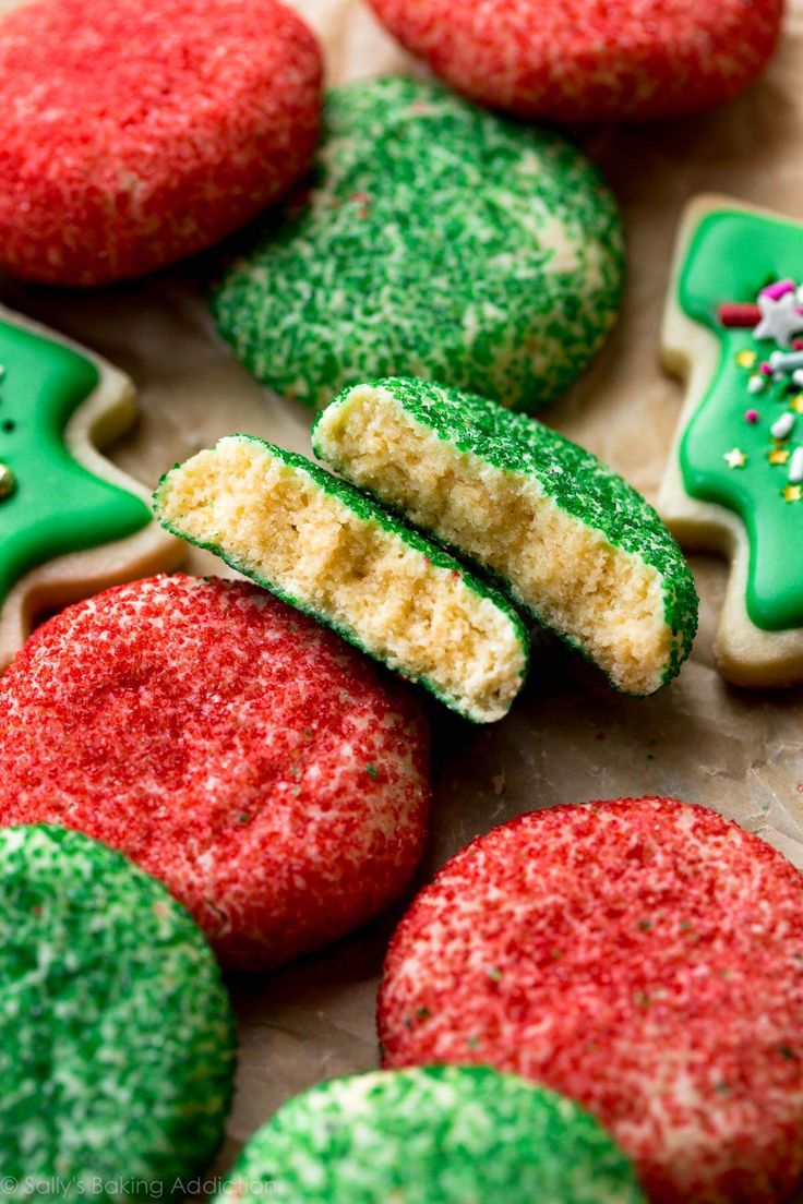 decorated cookies with green and red frosting on a table