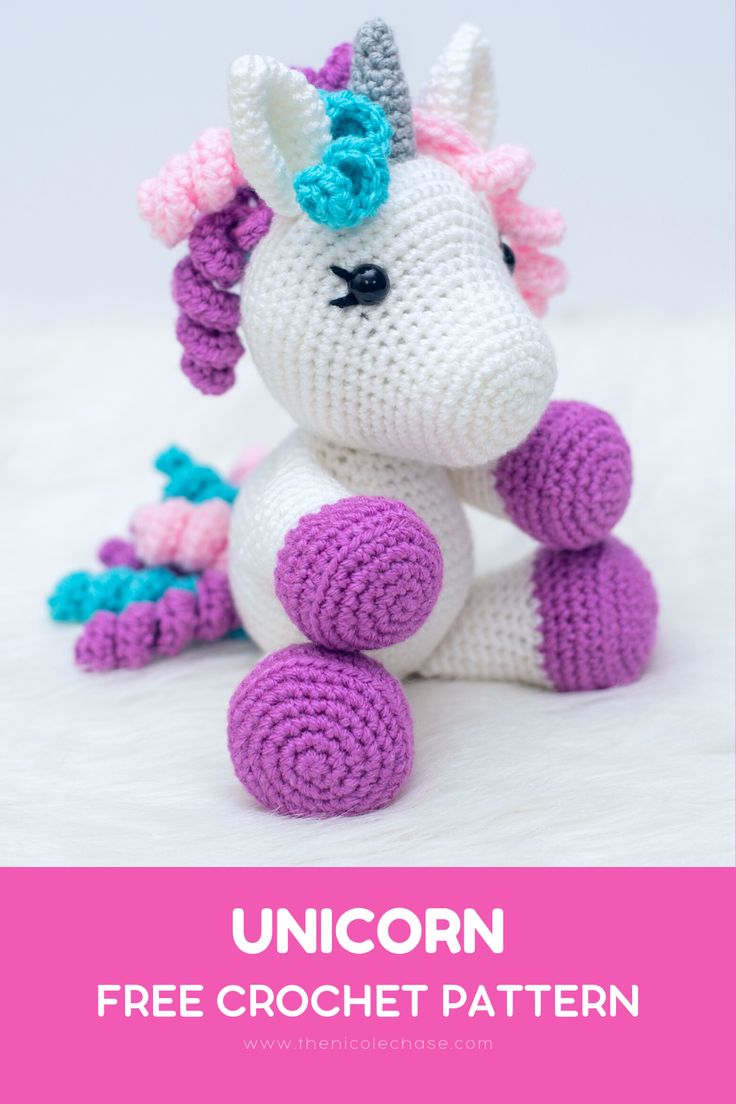 a crocheted unicorn sitting on top of a white surface with the words unicorn free crochet pattern