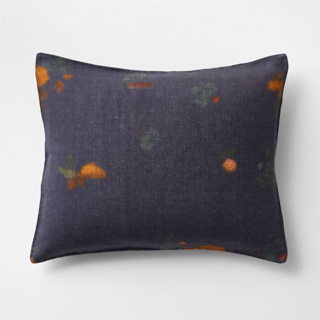 a blue pillow with oranges on it