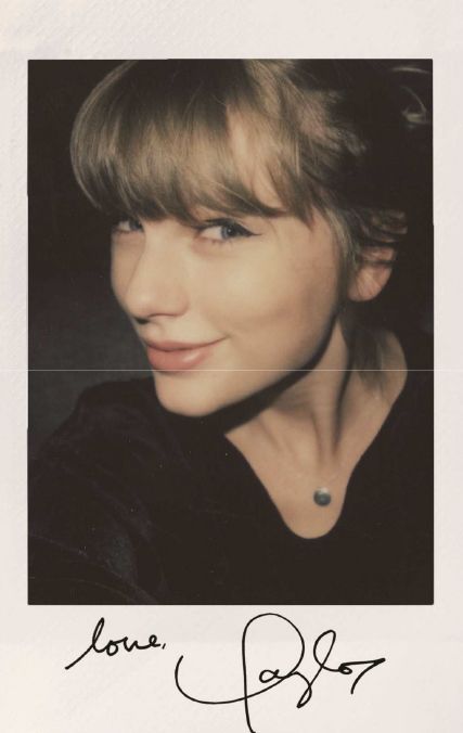 a woman with blonde hair wearing a black shirt and smiling at the camera, in a polaroid