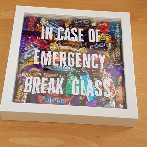 an emergency break glass box filled with candy