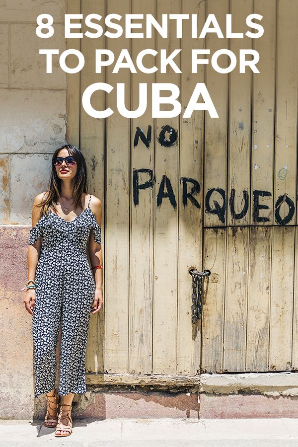 a woman standing in front of a door with the words 8 essentials to pack for cuba