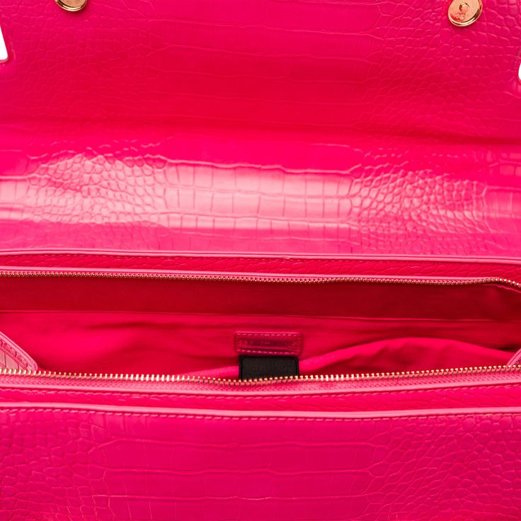 On Wednesdays, we travel in pink. Execuluxe is proud to offer the Emerson, a stylish two-in-one travel bag that is both stylish and functional! The Details Patent Pending one-of-a-kind design State-of-the-art removable trolley system that turns your bag into an instant rollerbrief - making travel a breeze Boasts large full size pockets and compartments for effortless organization both inside and out Cell phone and sunglass compartments Cushioned compartment for laptop/tablet Water bottle strap Key Leash - never lose your keys again! Carry-on compliant Large zipper closure Stylish Flip Top What’s Included State-of-the-art removable trolley Your choice of three matching accessories including a laptop case, padfolio, passport holder, wallet, lunch tote, or clarity case The Specs Size: 15.5” x Designer Box Bag With Detachable Strap For Travel, Designer Travel Flap Bag With Detachable Handle, Designer Double Handle Flap Bag For Travel, Designer Flap Bag With Detachable Handle For Travel, Designer Travel Flap Bag With Top Carry Handle, Luxury Tote Flap Bag For Travel, Luxury Flap Tote Bag For Travel, Luxury Travel Tote Flap Bag, Luxury Shopping Satchel With Adjustable Handle